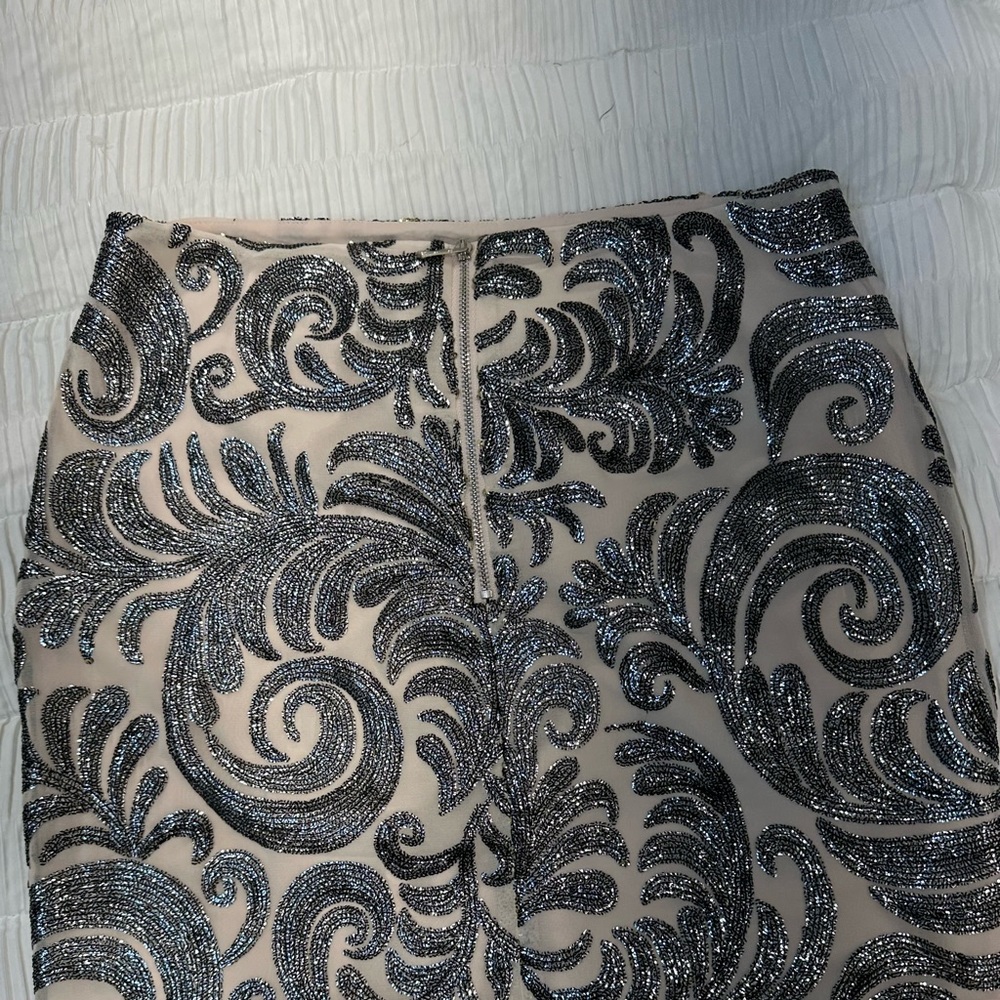 Chic Metallic silver design skirt; dress it up with a any top new Missing tag .